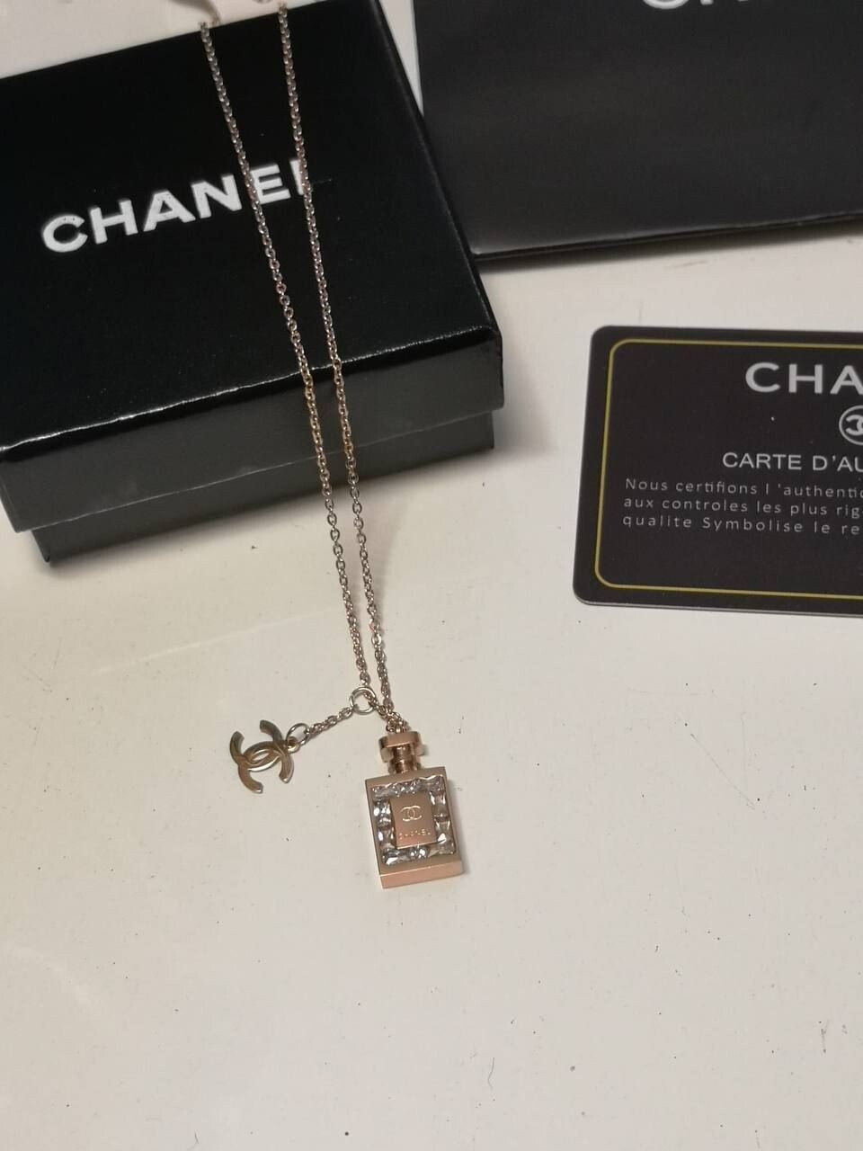 3530880458.jpg Chanel Women Rose Gold Reps Perfume Pendant Gold Chain Necklace Replica Women Cheap Girls Stylish Design Rep CC Studded Fake EAU DE Pefum Bottle First Copy Fashion Zirconia Jewelry Sale UK - Image 1