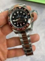 Rolex GMT Master II Black Dial Watch in Two Tone Chain Strap with Gold Bezel - Image 2