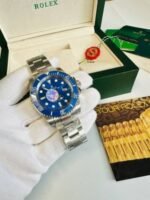Rolex Submariner Blue Dial Watch with Silver and Two Tone Strap Men's - Image 2
